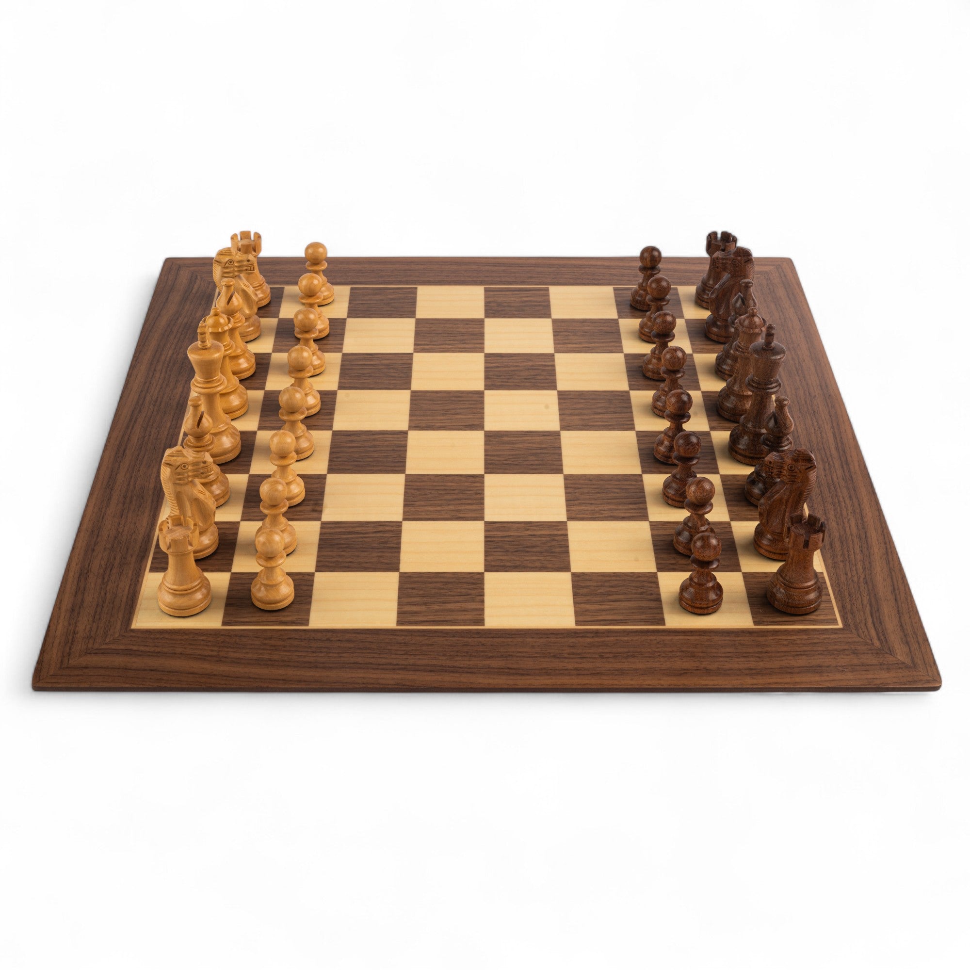 Wooden chessboard with pieces on a white background