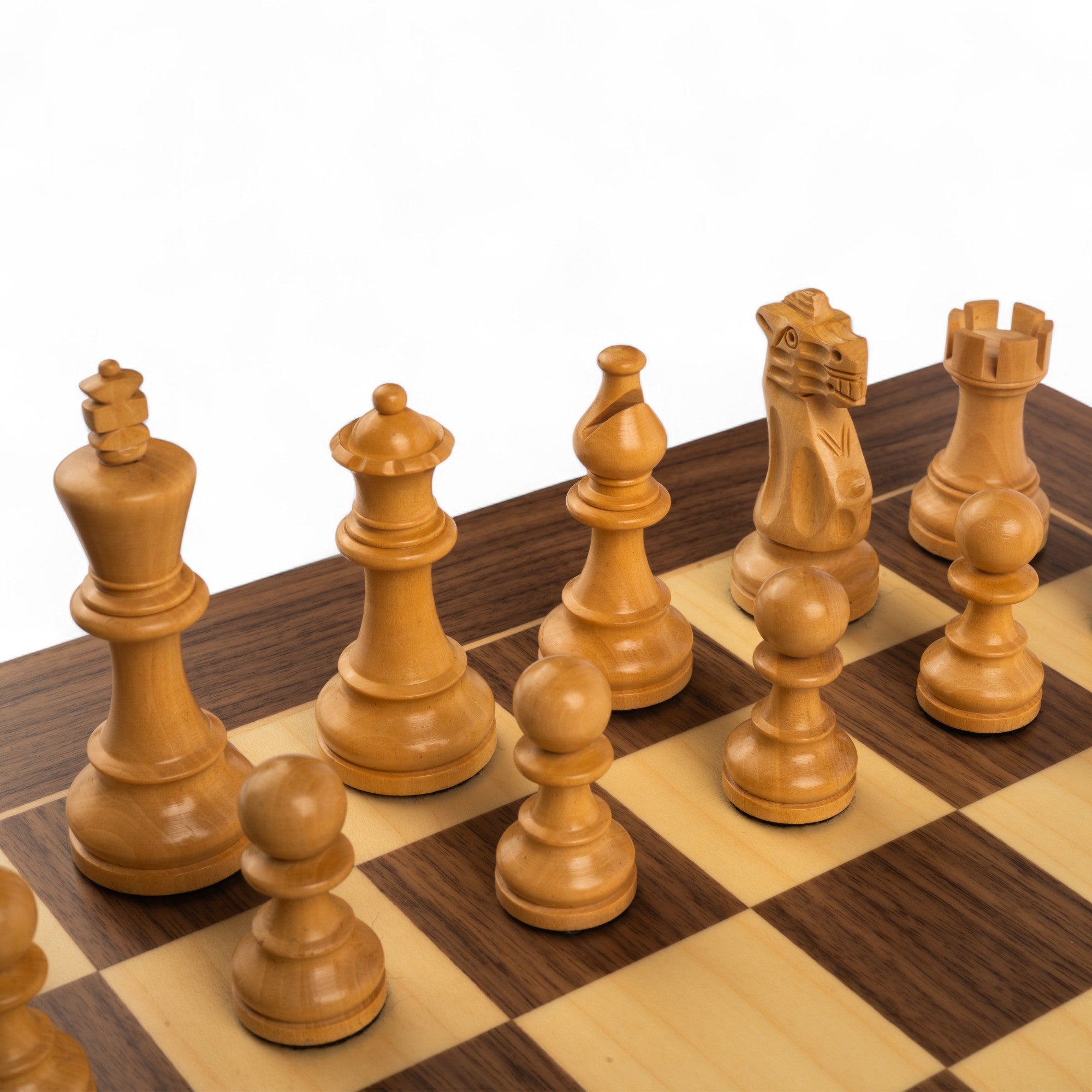 Wooden chess pieces on a wooden chessboard