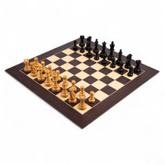 Wooden chessboard with black and brown pieces on a white background