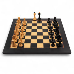 Wooden chess pieces on a checkered chessboard