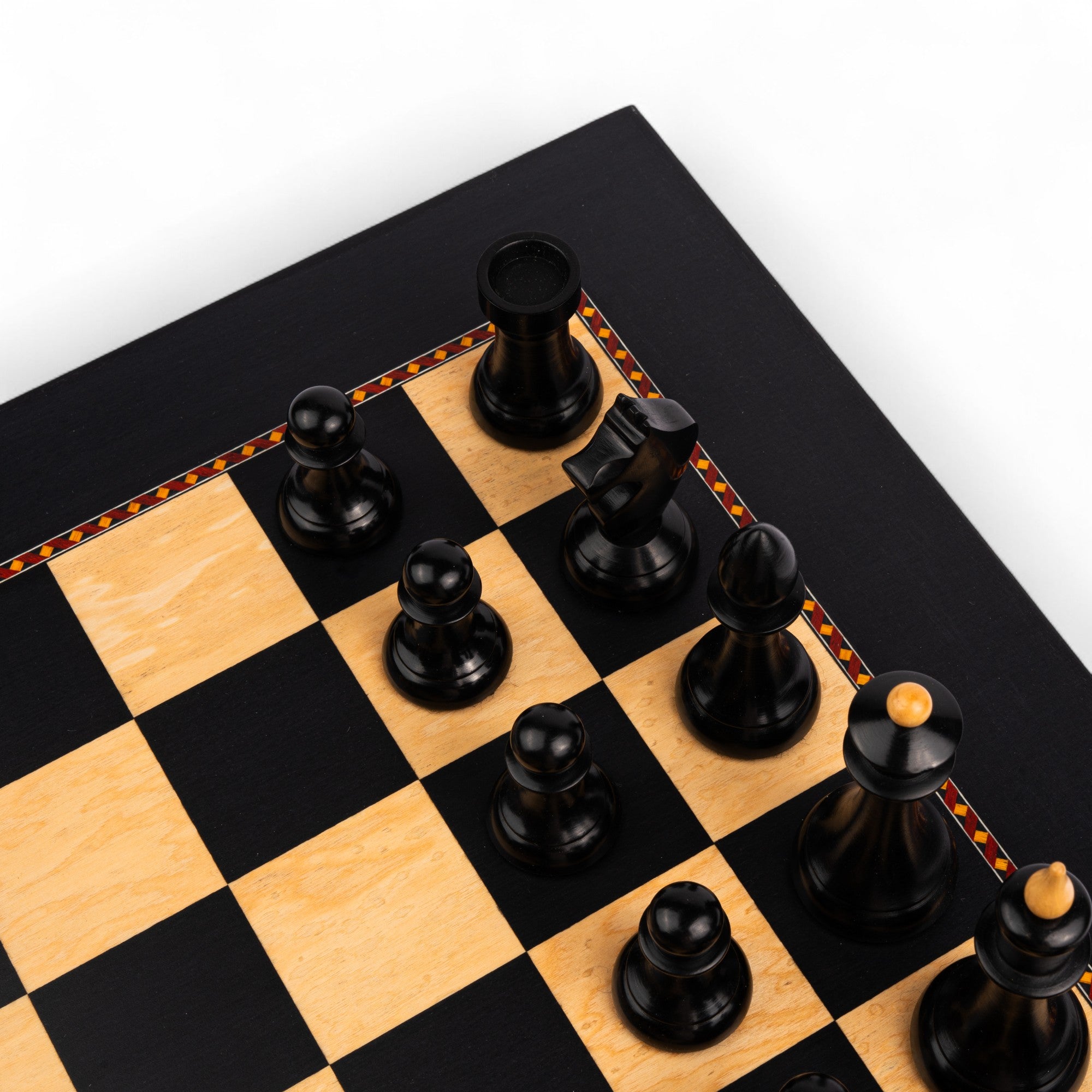 Wooden chess pieces on a checkered chessboard