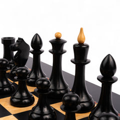 Wooden chess pieces on a checkered chessboard