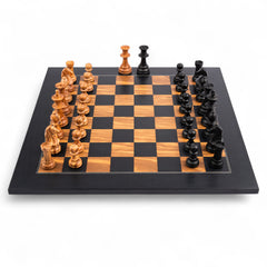 Wooden chess pieces on a checkered chessboard