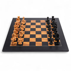 Wooden chess pieces on a checkered chessboard