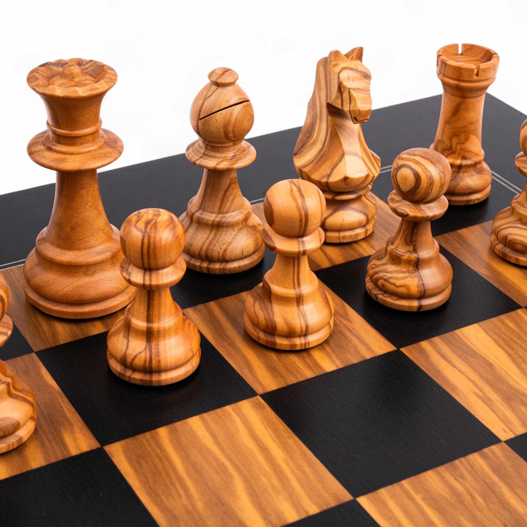Wooden chess pieces on a checkered chessboard