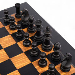 Wooden chess pieces on a checkered chessboard