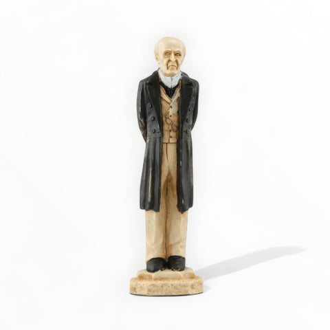 A hand painted chess piece depicting Professor Moriarty from The stories of Sherlock Holmes.