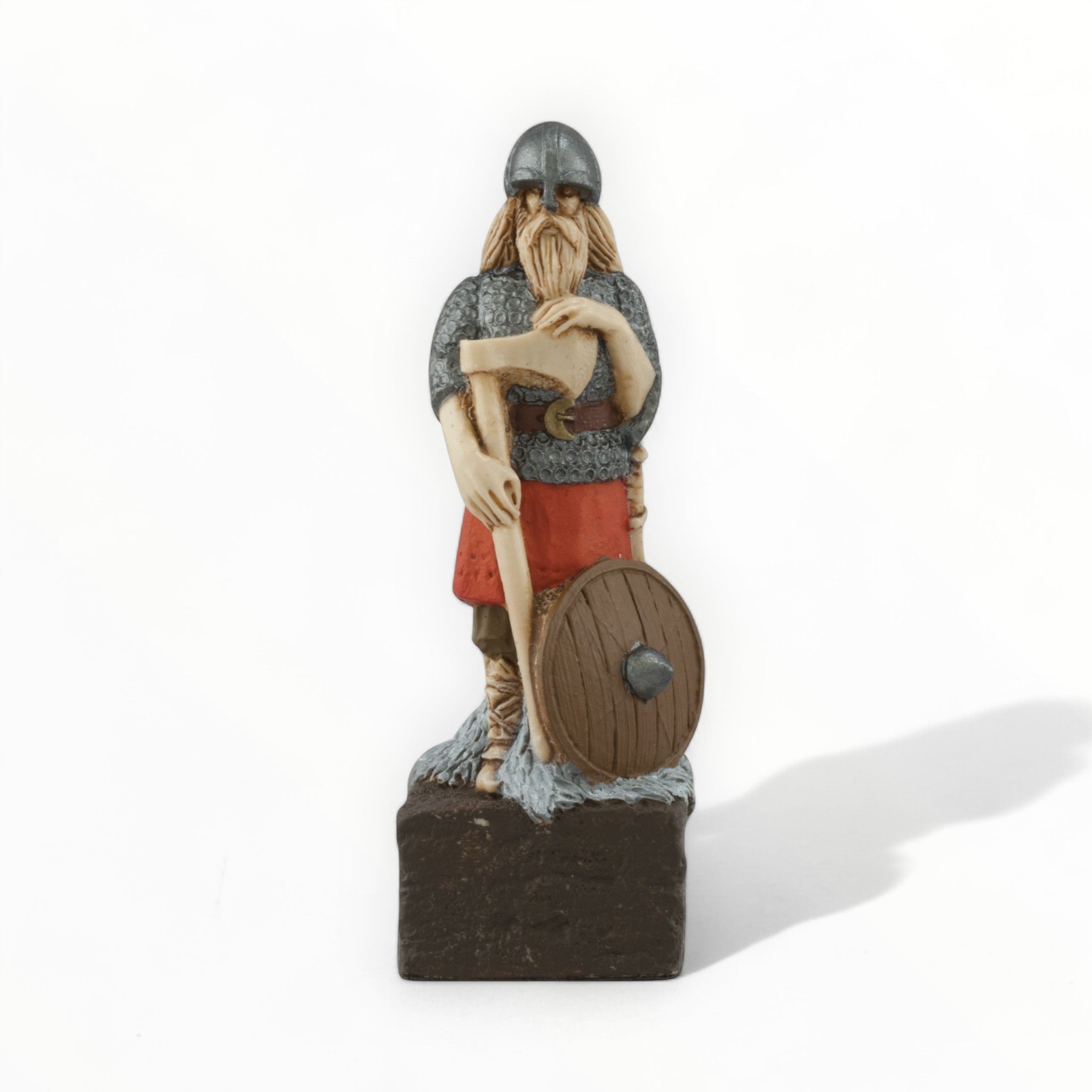 A hand painted chess piece depicting a Viking Warrior.